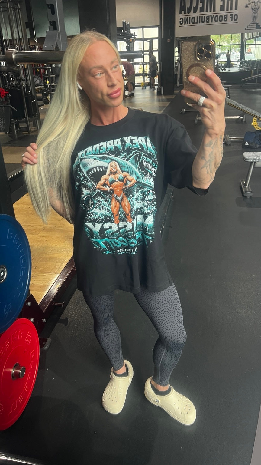 Missy Truscott wearing the black 2026 Apex Predator shark T-shirt